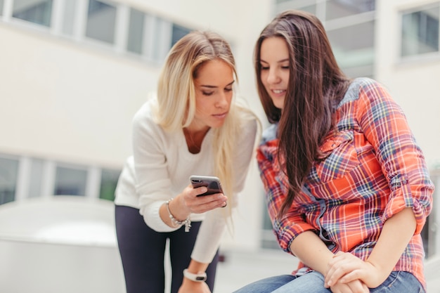 Women looking at screen of phone