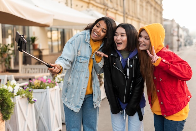 Women making a selfie using a selfie stick