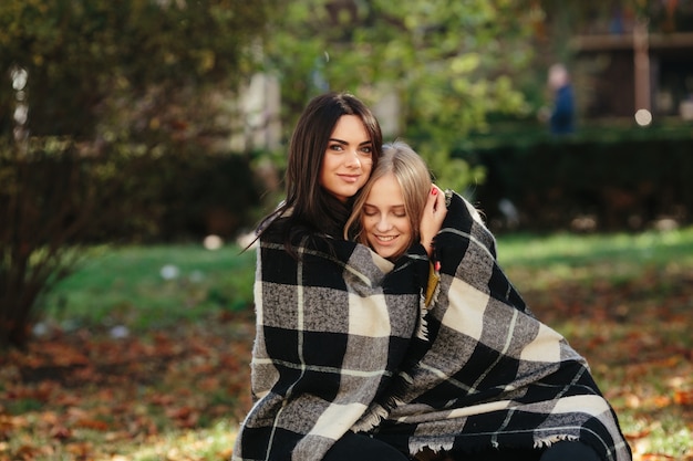 Women in plaid in park