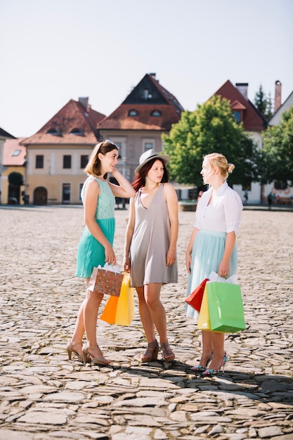 Women posing with paper bags