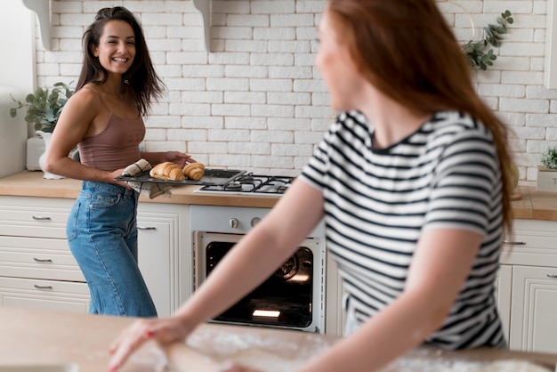 Women preparing together a romantic dinner