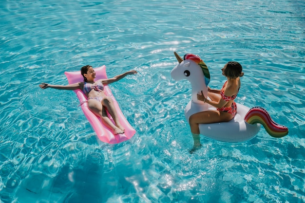 Women relaxing in pool