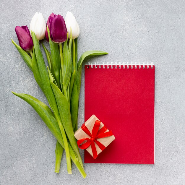 Women's day concept composition with red notepad