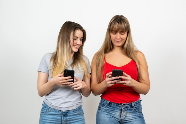 Women sharing the content read on phone