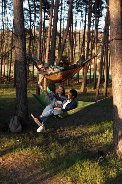 Women sitting in hammocks full shot