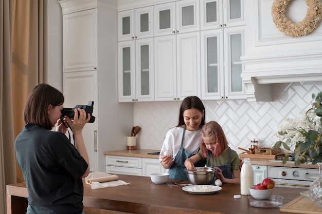 Women spending time together with their daughter at home