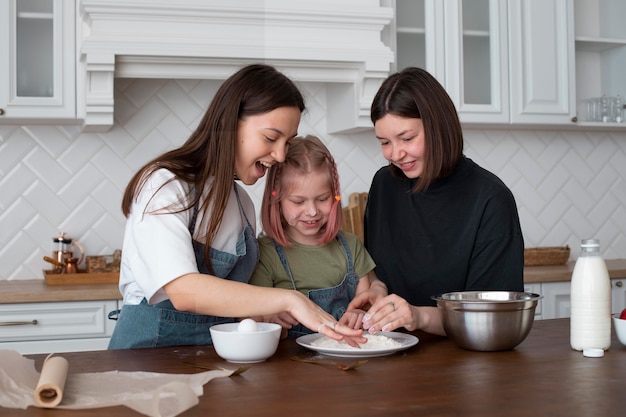 Free photo women spending time together with their daughter