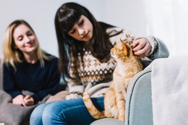 Women spending time with cat