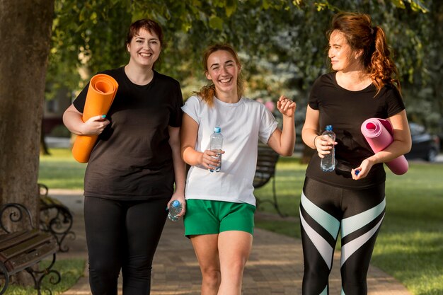 Women in sportswear chatting outside