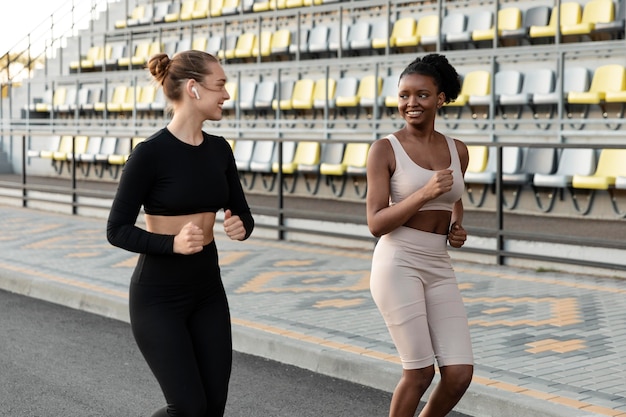 Women in sportswear working out outdoors