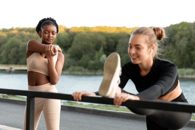 Women in sportswear working out outdoors