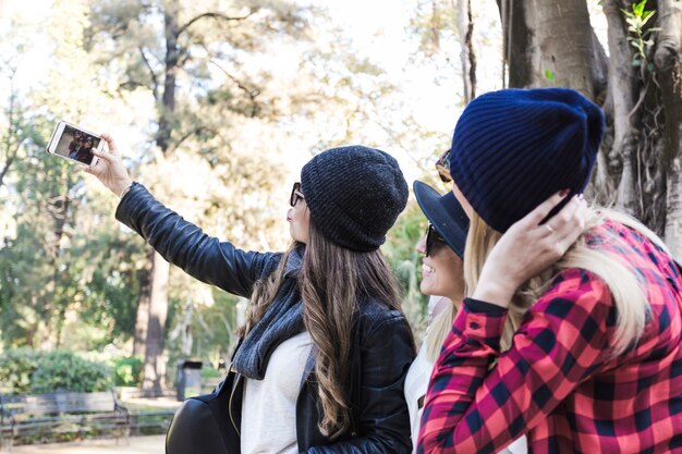 Women taking selfie on street