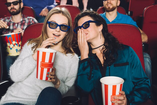 Women talking during movie