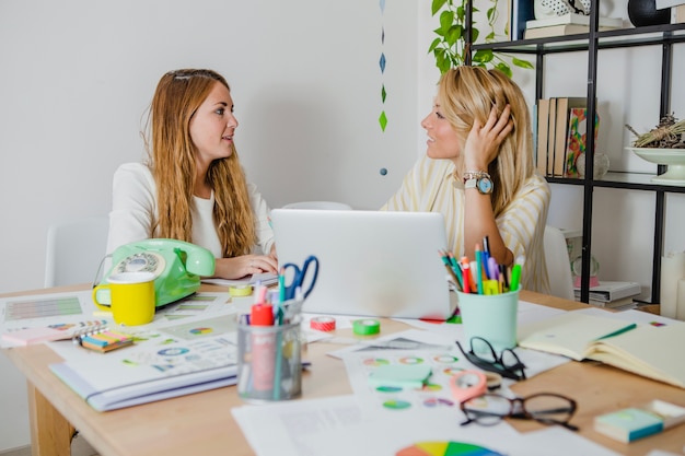 Women talking in office