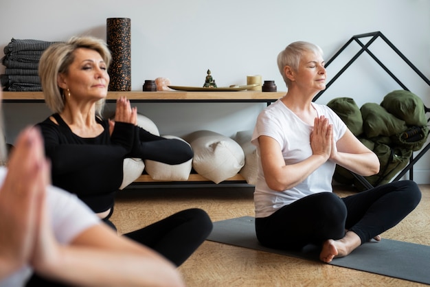 Free photo women at their yoga session