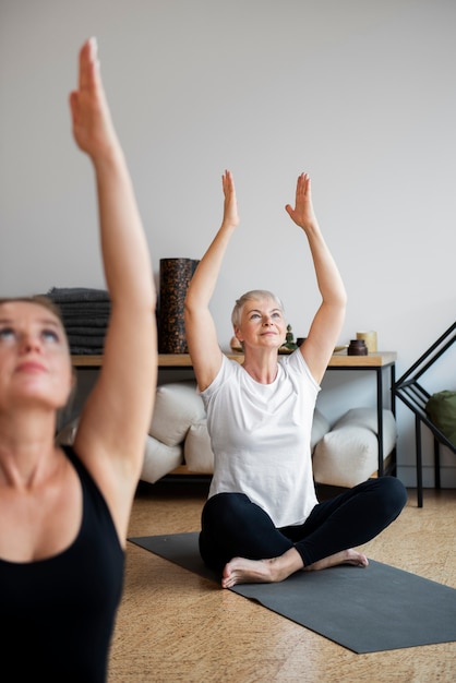 Free photo women at their yoga session