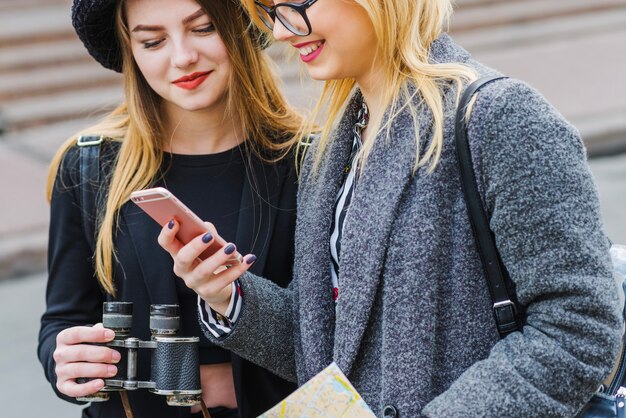 Women tourists using phone