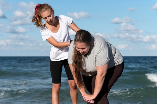 Women training together medium shot