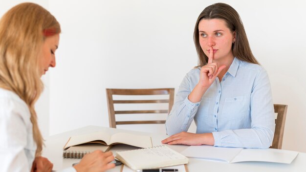 Women using sign language to communicate