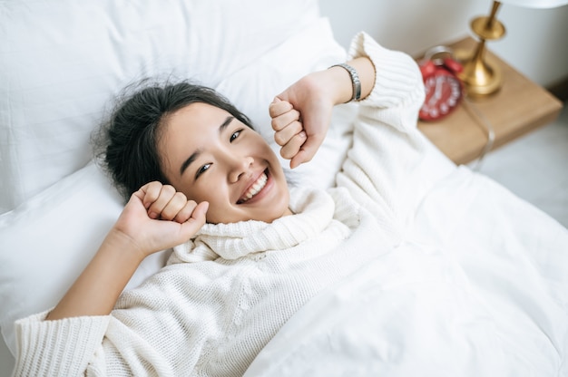 The women wear white shirts and wake up.