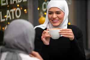 Free photo women wearing hijab an having a good time