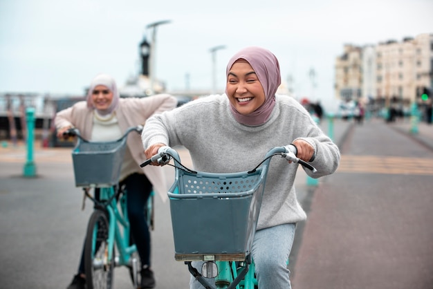 Free photo women wearing hijab an having a good time