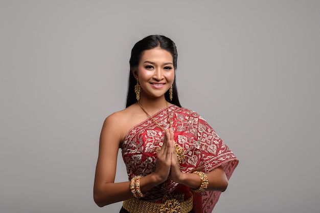 Free photo women wearing thai clothing that pay respect,sawasdee symbol