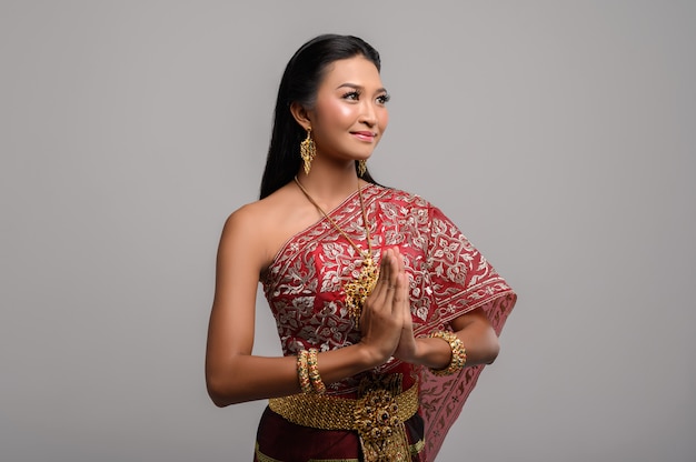 Free photo women wearing thai clothing that pay respect,sawasdee symbol