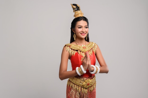 Free photo women wearing thai clothing that pay respect,sawasdee symbol