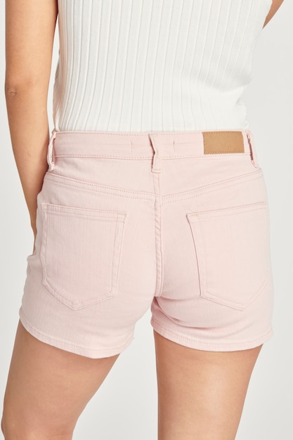 Women white crop top and light pink short jeans mockup