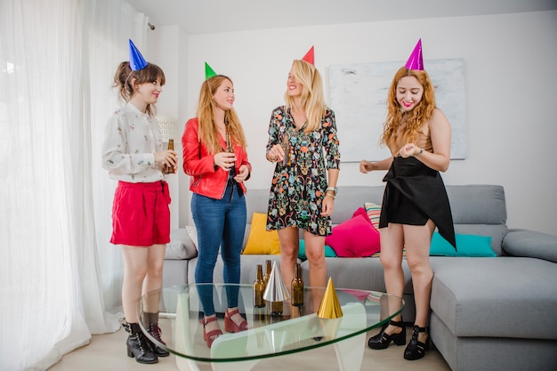 Women with beer and paper hats