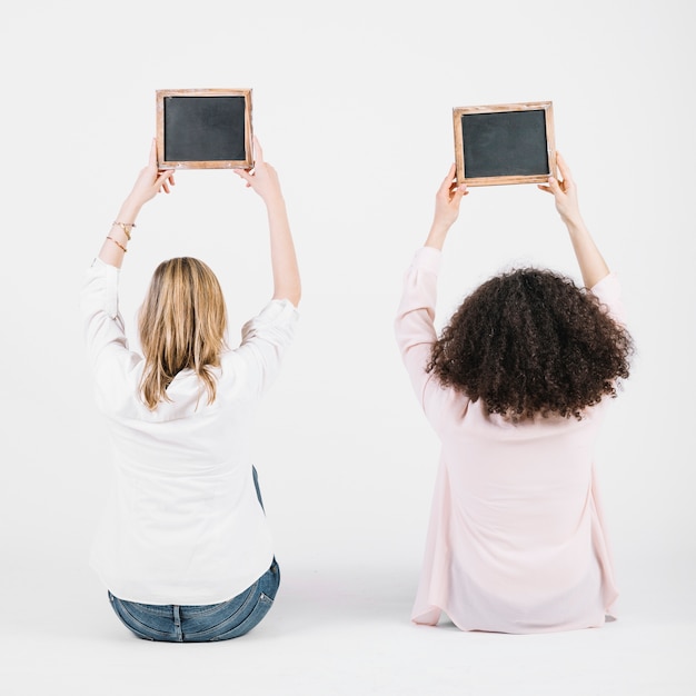 Free photo women with blackboard