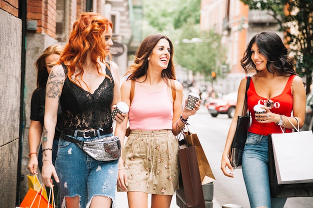 Women with coffee and bags