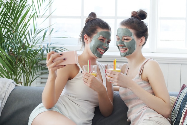 Women with facial mask, beauty and skin care concept