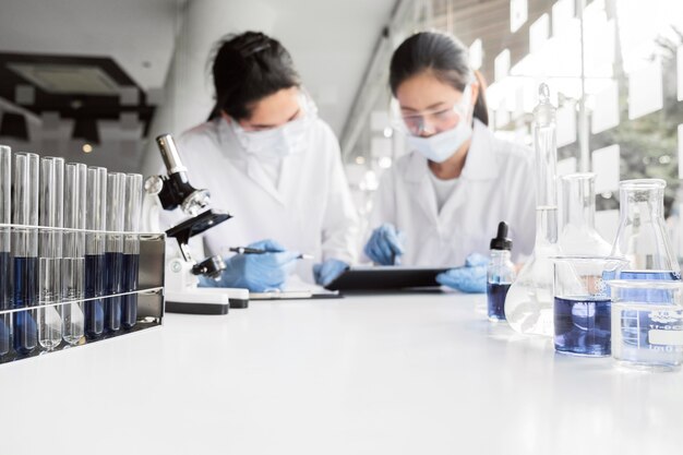 Free Photo women working on a chemical project for a new discovery