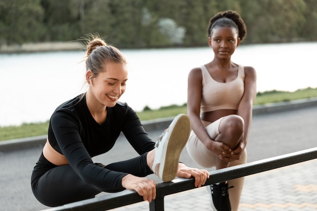 Free photo women working out together outdoors