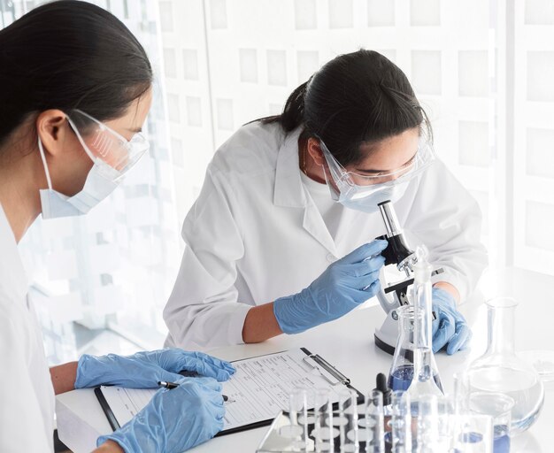 Women working together on a chemical project