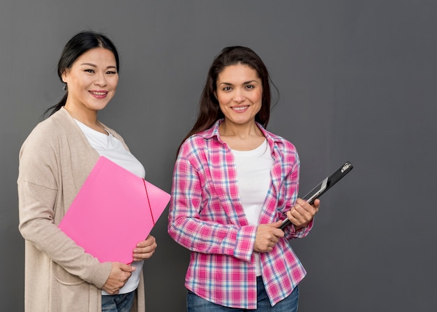 Womens holding clipboard