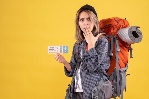 wondered traveler girl with backpack holding plane ticket