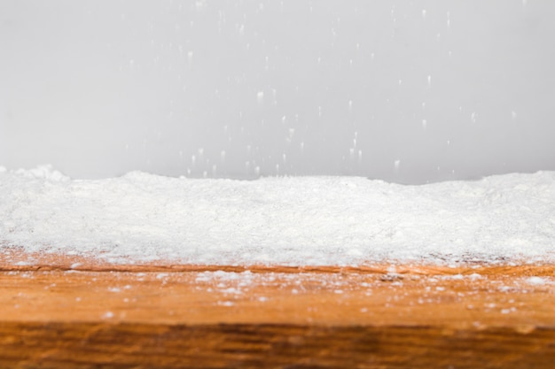 Wood board and heap of snow