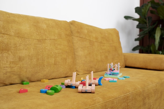 Wood educational games on yellow couch