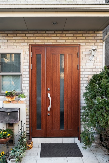 Wood house entrance and dark mat