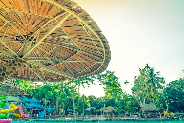 Wood roof and a swimming pool .