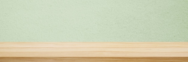 Wood table and green wall background in kitchen wooden shelf counter for food and product display