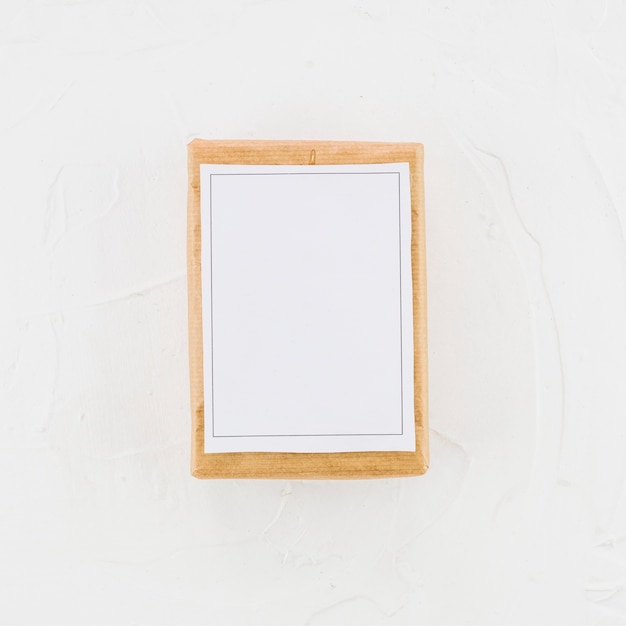 Free photo wood tablet with white paper