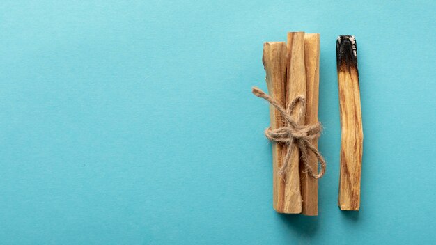Wooden aromatic sticks tied with a rope copy space