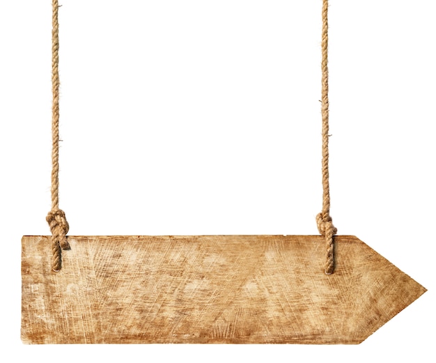 Free photo wooden arrown hanging from ropes.