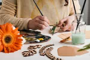 Free photo wooden art pieces painting process