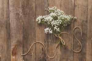 Free photo wooden background with floral decoration