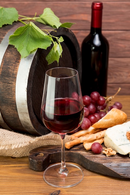 Wooden barrel next to wine and tapa